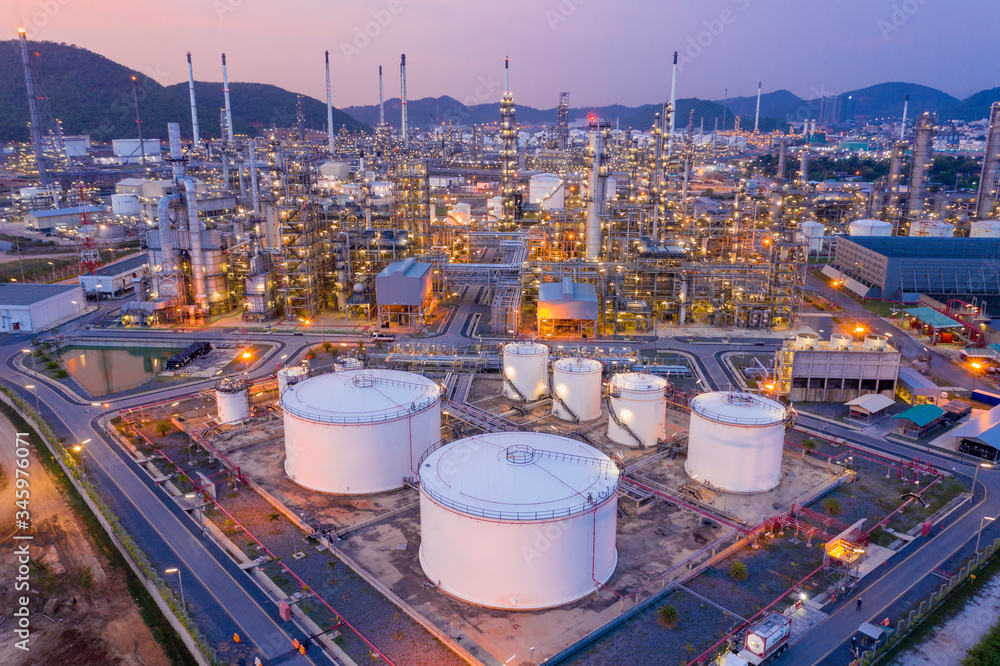 ภาพถ่าย Stock Aerial view Refinery and oil storage tanks at dusk and ...