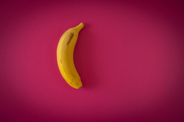 YELLOW BANANA on fuchsia background