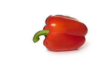 Red bell pepper lies on a white background. Bright color. One object isolated on white background.