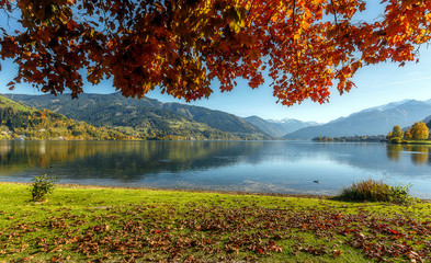 Fototapete - Beautiful Autumn scenery. A beautiful view from Lake Zell. Wonderful Autumn landscape in Alps with Zeller Lake in Zell am See, Salzburger Land, Austria. Natural background. Amazing nature landscape