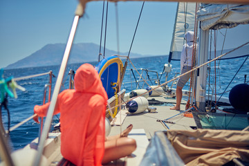 Wall Mural - Summertime cruising enjoying on a sailing boat at open sea.