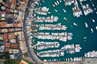 © vladim_ka - Top view on a harbor with moored sea ships, yachts and sailboats in Ligurian Sea. Santa Margherita Ligure is an italian riviera near Portofino and Genoa.