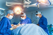 © Vadim - Team surgeon at work in operating room. Modern equipment in operating room. Medical devices for neurosurgery.