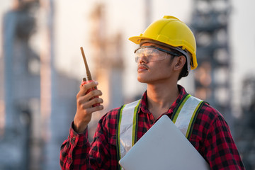 Refinery industry engineer  wearing PPE Working at refinery construction site