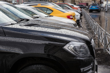 Canvas Print - Car in the parking lot in the rain