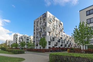 Cityscape of a modern residential area with apartment buildings, new green urban landscape in the city