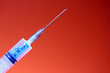 Syringe with a chip. The concept of the theory of conspiracy and implantation of vaccinated chips. Global control of humanity.
