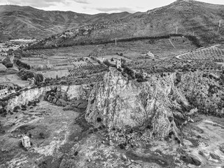 Wall Mural - Aerial view of an ancient tower on the cliff of a small hill, Tuscany, Italy