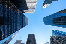 Tall Skyscrapers In The City Looking Upwards With Blue Sky Background