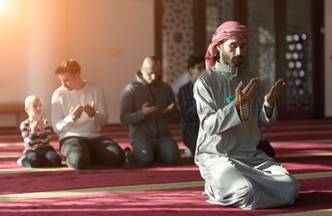 Wall Mural - muslim people praying in mosque