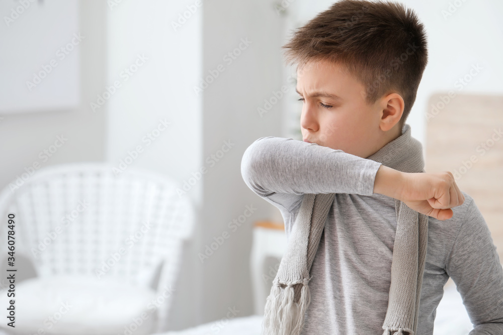 Ill coughing little boy at home