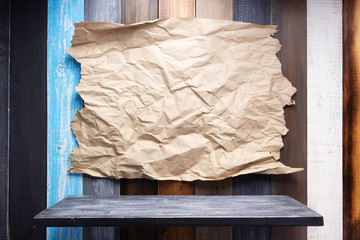 Wall Mural - wrinkled paper at wooden board  background