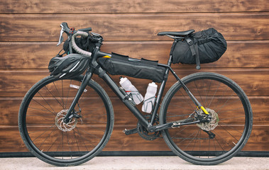 The bicycle packed with a lot of bags and other equipment ready for adventure and travel