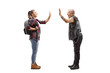 © Ljupco Smokovski - Female student gesturing high-five with a mature punk man