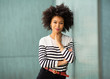 © mimagephotos - beautiful young african american woman leaning against wall