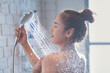 © torwaiphoto - Asian woman enjoying the shower She feels relaxed