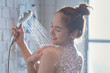 © torwaiphoto - Asian woman enjoying the shower She feels relaxed