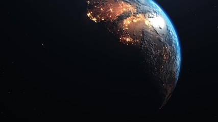 Wall Mural - view of forest fires and wars from space. a fiery glow is visible on the shadow side of the planet a