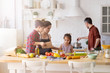 © deniskomarov - Mother and boy son talking to upset daughter on the kitchen
