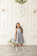 Wall Mural - Little girl child in a fashionable dress