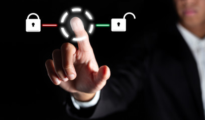 businessman touch on graphic for icon with fingerprint to unlock the key in office to scan for access and authorization connect online social business and network in office with technology concept