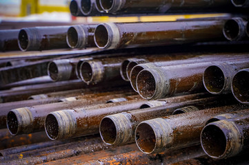 Wall Mural - Construction of Oil and Gas Pipeline, horizontal directional drilling. Drilling of oil and gas wells. In the foreground, a threaded joint of pipes