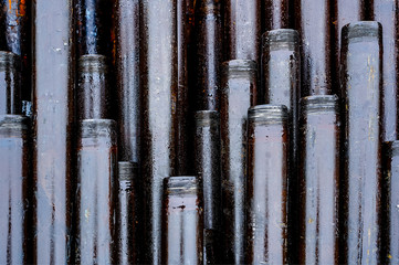 Wall Mural - Oil Drill pipe. Rusty drill pipes were drilled in the well section. Downhole drilling rig. Laying the pipe on the deck. View of the shell of drill pipes laid in courtyard of the oil and gas warehouse