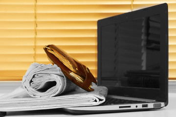 Wall Mural - Newspapers, Laptop and Wallet. Pile of Magazines Stacked on Keypad of Notebook. Pages with News, Computer and Money in Cash, Business Concept  