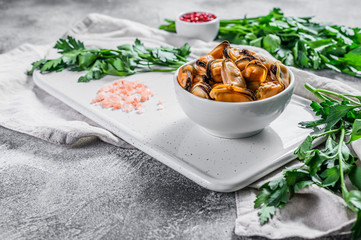 Boiled mussel meat on a cutting Board. Healthy seafood. Light background.