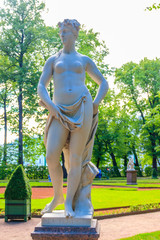 Marble statue of muse of lyric poetry Euterpe in old city park Summer Garden in St. Petersburg, Russia