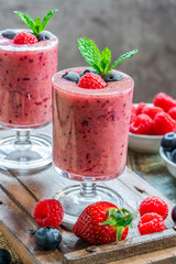 Sticker - Mixed berry smoothie garnished with fresh fruit and mint