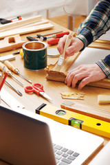 Wall Mural - Decorator varnishing a wooden frame