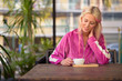 © Ranta Images - Happy young beautiful blonde woman relaxing at the coffee shop