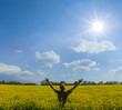 © Yuriy Kulik - happy man stay among yellow rape field under a sparkle sun, agricultural rural scene