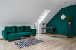 © Dariusz Jarzabek - Attic living room with emerald details