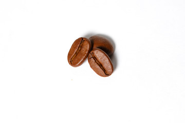 Roasted coffee beans isolated on a white background. Brown coffee beans Robusta chocolate shade