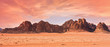 © Lubo Ivanko - Planet Mars like landscape - Photo of Wadi Rum desert in Jordan with red pink sky above, this location was used as set for many science fiction movies