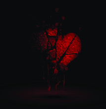 Red Broken Heart On The Black Background