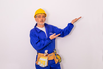 Wall Mural - construction worker with tools and helmet isolated on white background