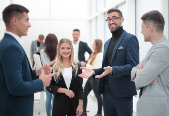 project Manager and working group standing in office