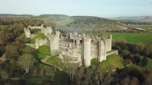 Panoramic Drone View Of Old Castle On A Hill Surrounded By Forests On The Outskirts Of A Small Town. Approaching Shot. Arundel Castle - England