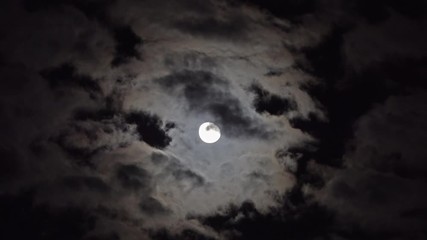 Wall Mural - full moon moving between clouds, 4k
