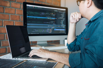 Developing programming and coding technology working in a software develop company office.