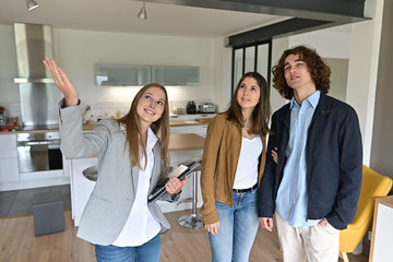 Young couple visiting modern apartment