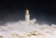 © mimadeo - lighthouse at night with storm and waves splashing