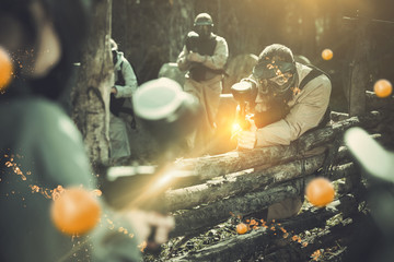 Wall Mural - Paintball team aiming outdoors