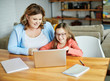 © Lumos sp - laptop computer education mother children daughter girl familiy childhood home child parent