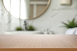 © New Africa - Empty wooden table and blurred view of stylish bathroom interior