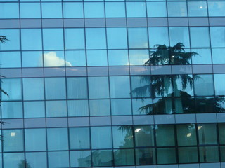 glass building facade in modern skyscraper and reflex