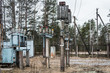 © OlegDoroshin - old abandoned power plant with rusty wires, structures, and equipment